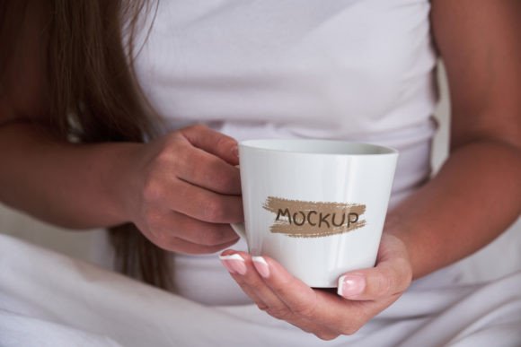 Elevate Your Brand with a Realistic Woman Holding Coffee Mug in Hands Mockup